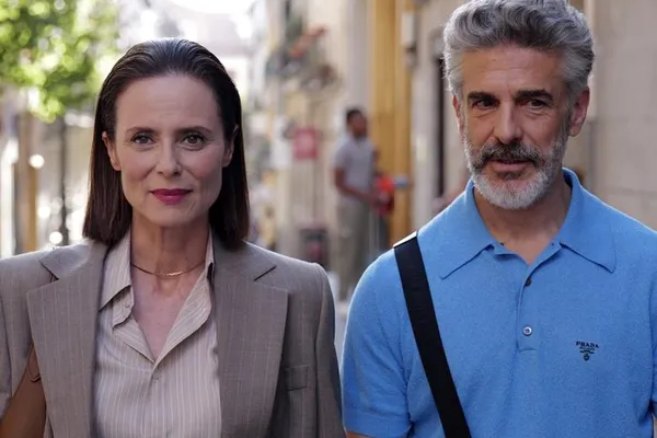 A woman and a man stand side by side