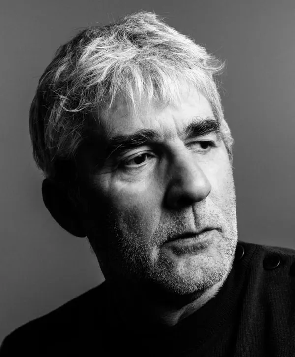 Black and white headshot of the director
