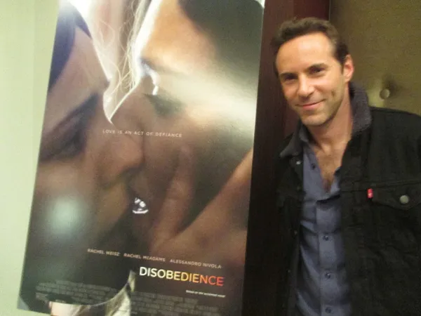 Alessandro Nivola with a Disobedience poster