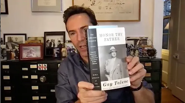 Alessandro Nivola with Gay Talese's book Honor Thy Father
