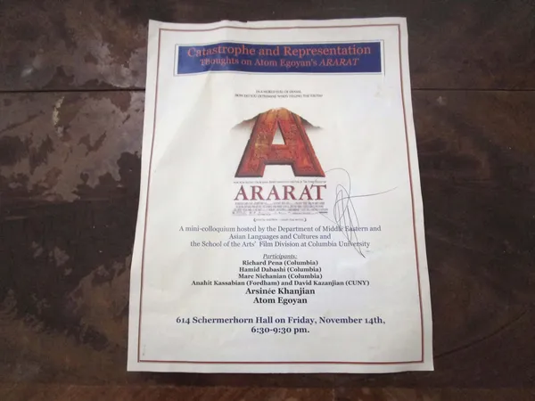 A flyer reading 'Catastrophe and Representation: Thoughts on Atom Egoyan's Ararat', signed by Atom Egoyan.