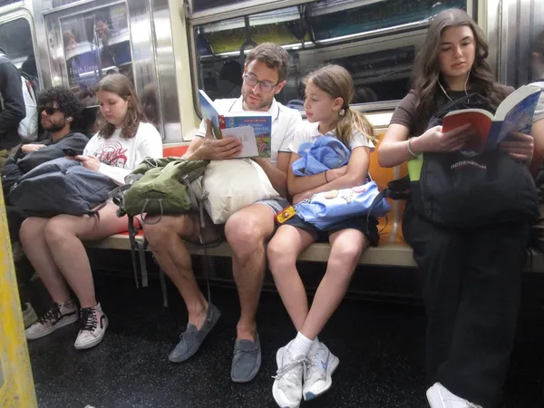 A father reading Astrid Lindgren’s Wir Kinder Aus Bullerbü