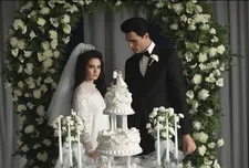 Priscilla (Cailee Spaeny) with Elvis (Jacob Elordi) and the wedding cake