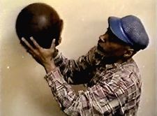 David Hammons making one of his Basketball Drawings, circa 2000