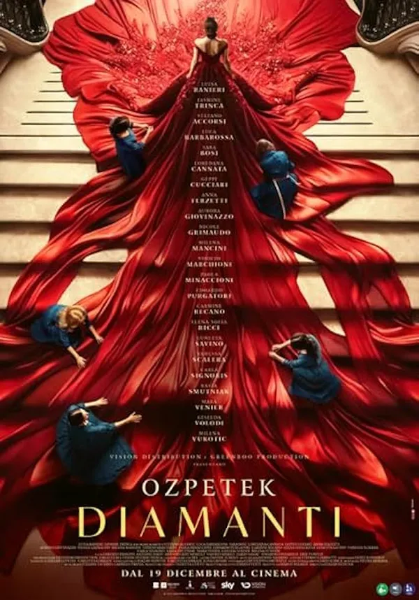 A poster for the film Diamonds. A white woman stands at the top of a board flight of stairs, wearing a red gown which stretches out four metres in front of her and eight metres behind her. Five white woman in blue dresses are on their knees adjusting it.