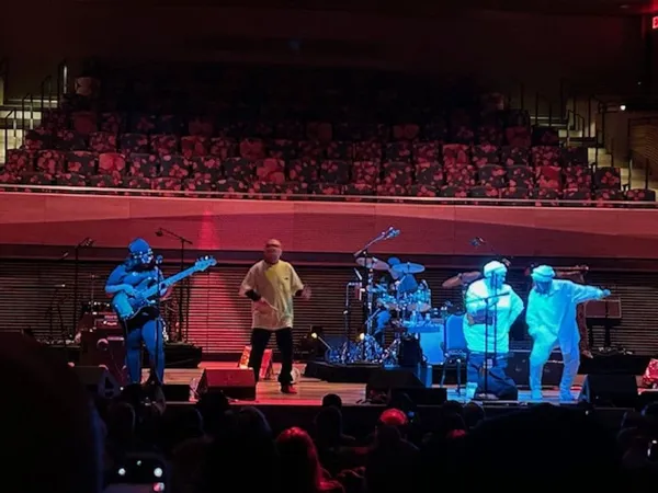 A band performs onstage.