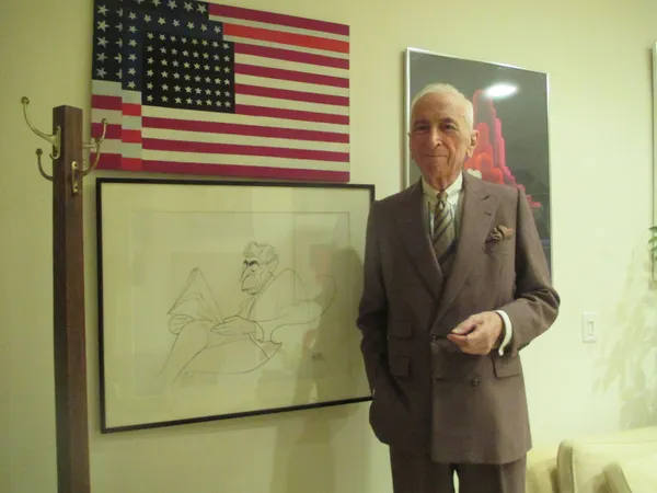 Gay Talese with an American flag painting