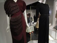 Sandy Schreier seen through a Shane Valentino and Nathan Crowley portal between two Gilbert Adrian dresses