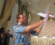 Terrence Howard displays his coat hanger twirling skills at the Waldorf Astoria with The Butler screenwriter Danny Strong being interviewed in the background