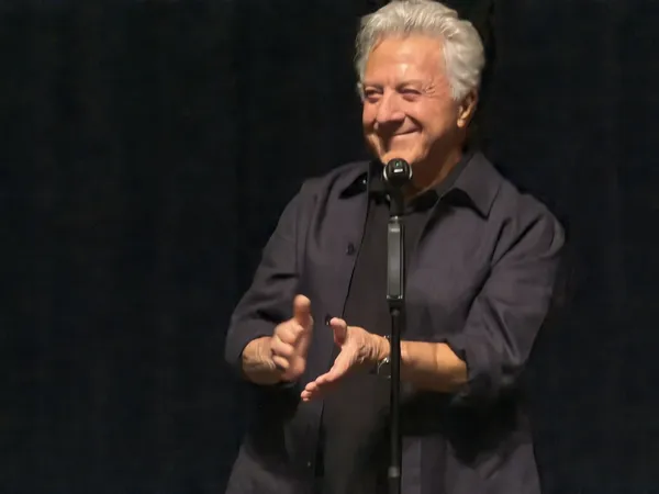 Dustin Hoffman applauds the crowd