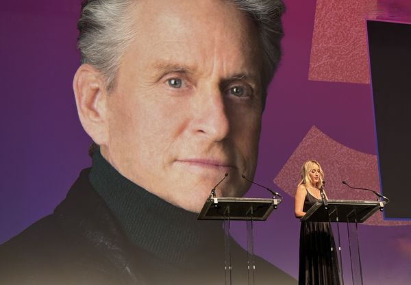 Michael Douglas is introduced by French actress Ludivine Sagnier at the opening ceremony of the 50th edition of the Deauville Festival of American Cinema