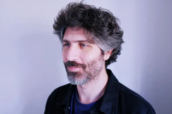 Headshot of director Iván Fund
