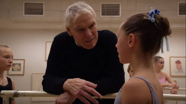 Jacques d'Amboise talks to a student