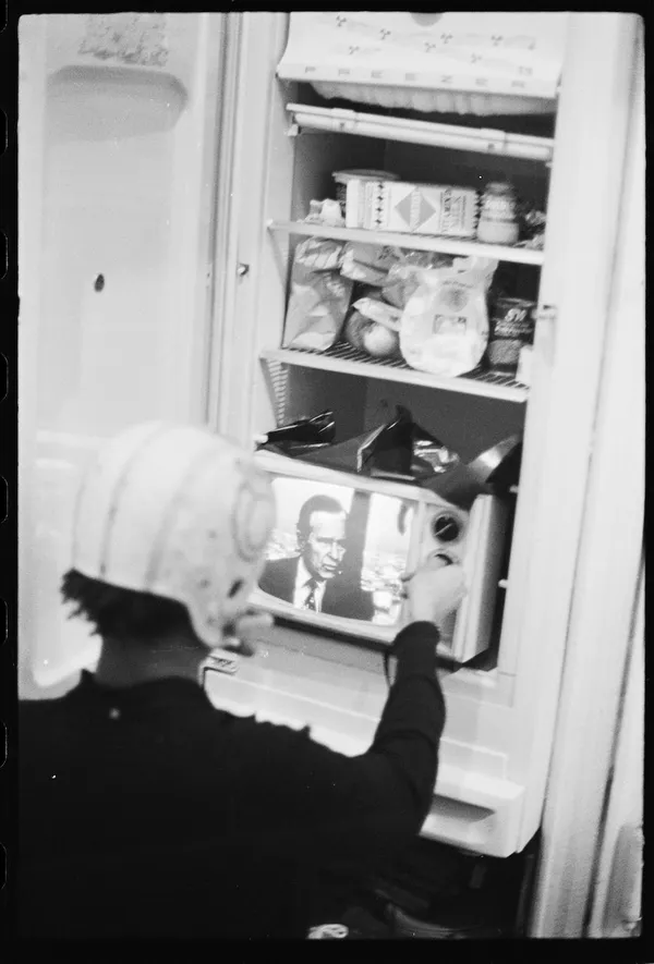 Jean-Michel Basquiat putting the TV into the refrigerator