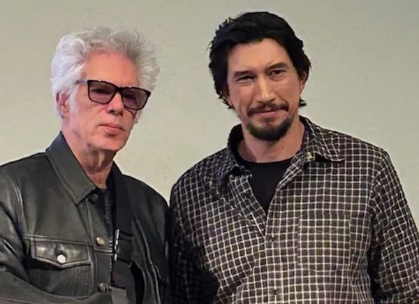 Jim Jarmusch and Adam Driver. An older white man with bleached hair, and a younger, larger white man with dark hair, beard and moustache.