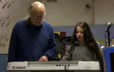 John Leyden teaching Eliza in the band room: "When we first heard her voice, it was wonderful."