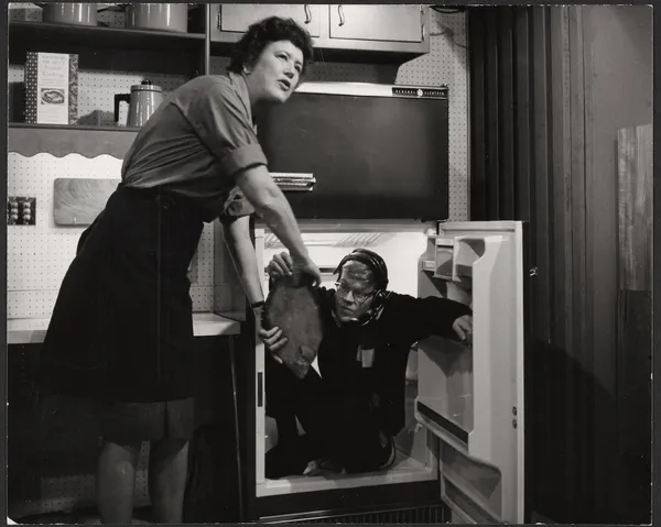 Julia Child receiving a fish