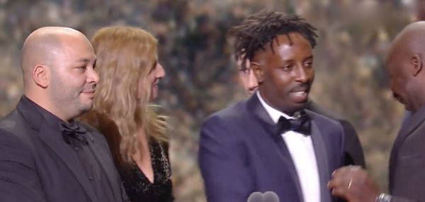 Ladj Ly on stage at the Césars when Les Misérables took the best film honour