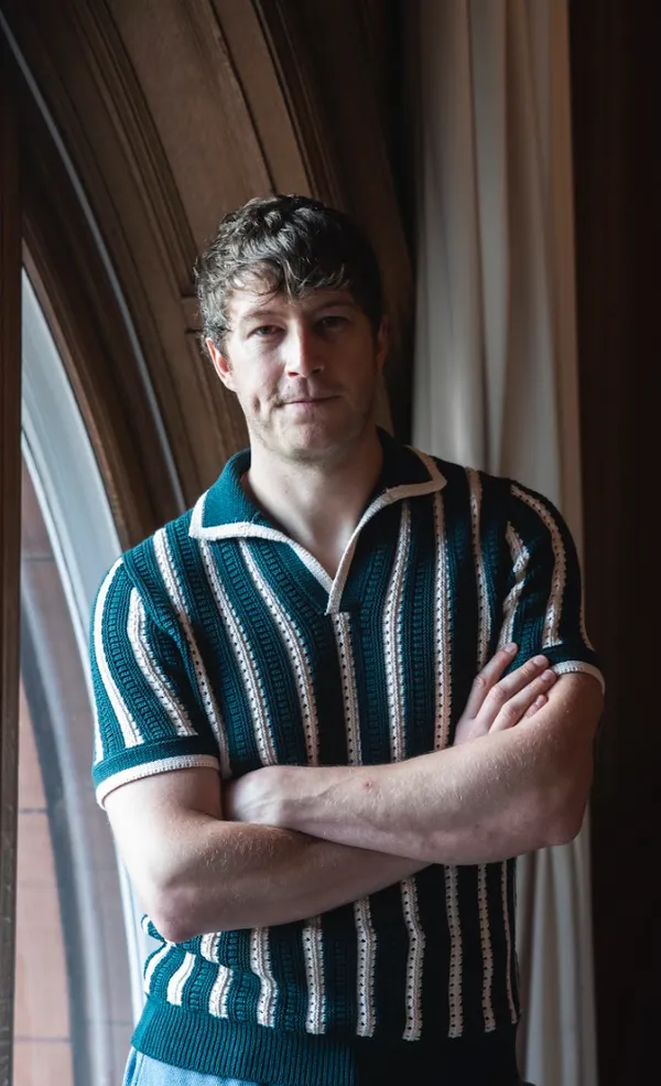 Lorne MacFadyen looks to the camera with his arms folded
