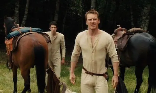 Michael Fassbender and Kodi Smit-McPhee as Silas and Jay