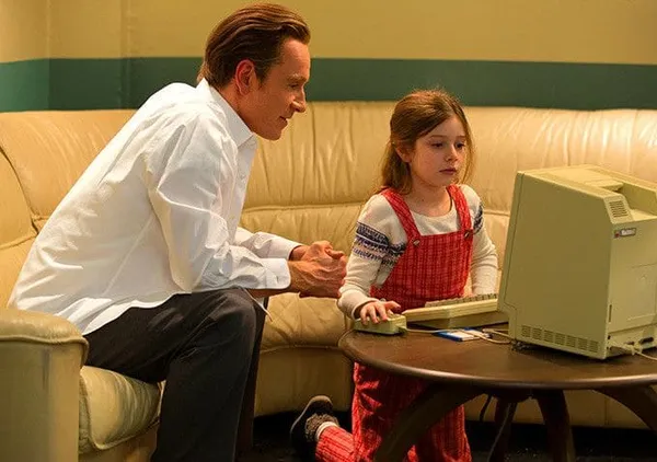 Michael Fassbender and Makenzie Moss in Steve Jobs