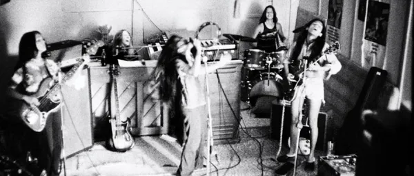 A black and white photograph of the band Fanny rehearsing at Fanny Hill.