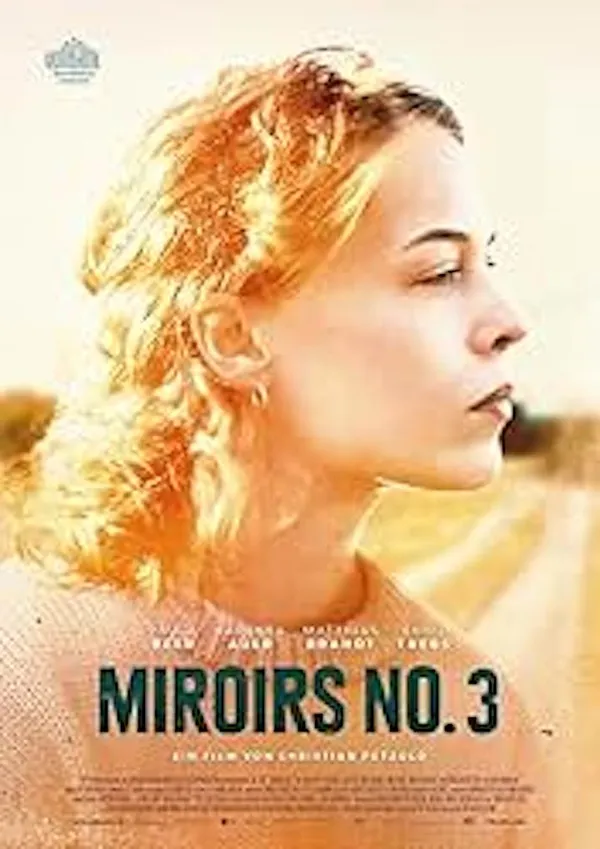 A poster for the film Mirrors No. 3. The face of a white woman, rendered in golden tones in the white sky above a country road.