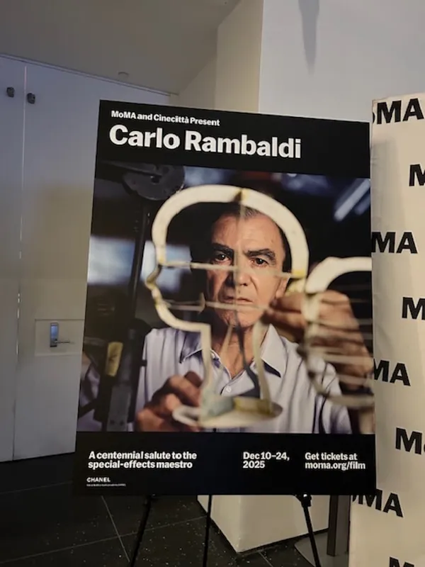 A poster headed 'Carlo Rambaldi', featuring a middle-aged white man holding up the frame of a human head sculpture in front of his own face.
