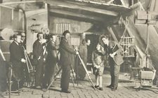 January 1925. First turn of the crank at the Boulogne studio. Abel Gance explains the filming set-up to the young Bonaparte (Vladimir Roudenko), surrounded by the technical crew