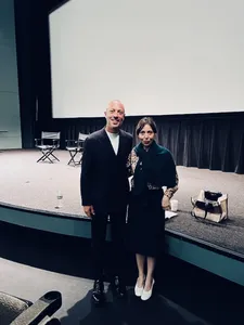 Cinecittà Studios Chief Nicola Maccanico with Anne-Katrin Titze in front of the US Scarlet poster at Open Roads: New Italian Cinema in New York
