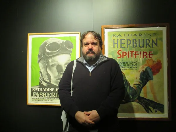 Olaf Möller in front of Katharine Hepburn posters for Christopher Strong and Spitfire: "Das Spukschloss im Spessart [The Haunted Castle]! Which is fantastic. Great musical! It's a horror musical."