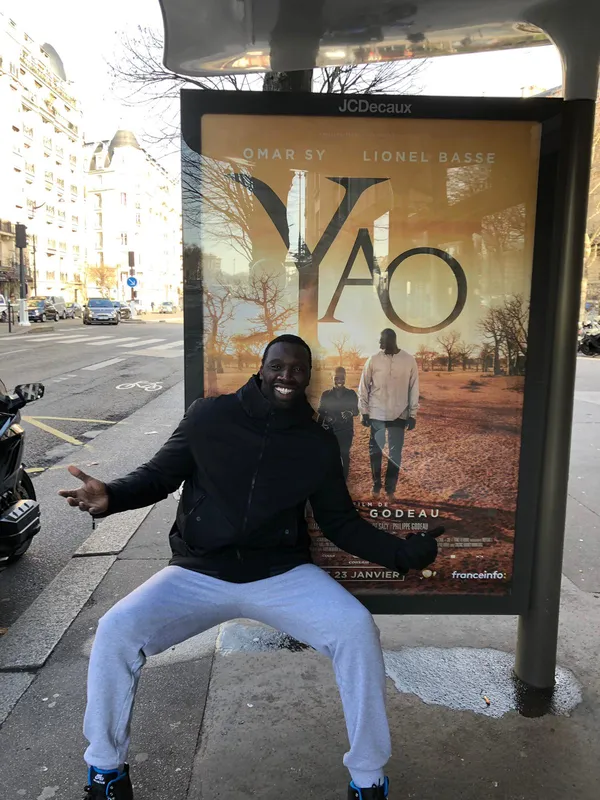 Omar Sy at a Paris bus stop