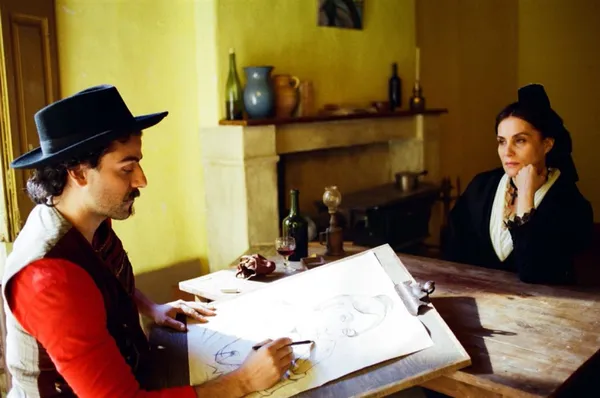 Oscar Isaac and Emmanuelle Seigner in At Eternity's Gate