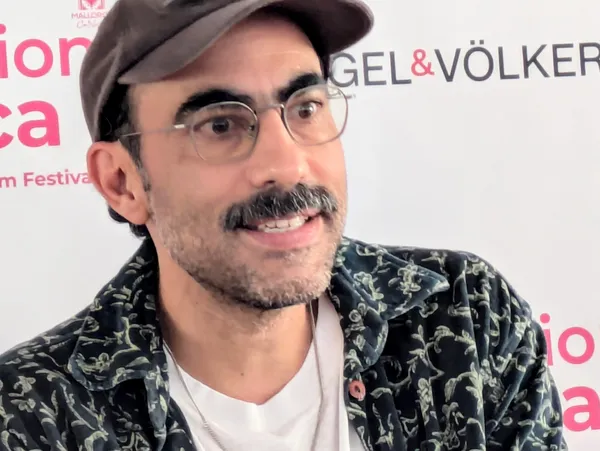Fernando Frias - he has a moustache, glasses and is smiling