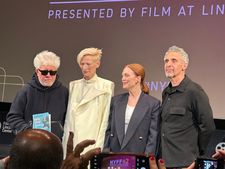 Pedro Almodóvar (holding up a copy of Sigrid Nunez's What Are You Going Through) with Tilda Swinton, Julianne Moore and John Turturro