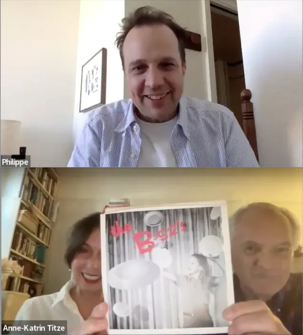 A Zoom call. A smiling white man occupies the upper window, while in the lower one, a middle aged white couple hold up a copy of the B-52s' record Rock Lobster.