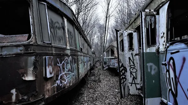 Two rusty streetcars in Scrap
