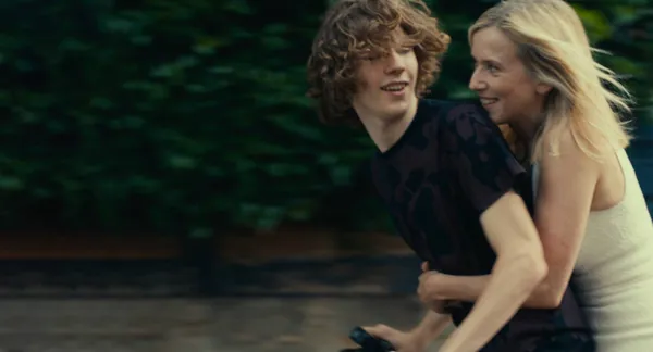 Samuel Kircher and Léa Drucker on a bicycle in Last Summer
