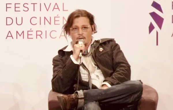 Johnny Depp in conversation in Deauville
