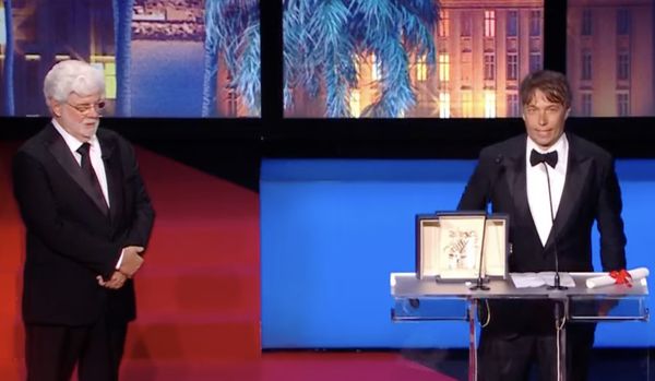 Hollywood veteran George Lucas looks on benevolently as Sean Baker receives his Palme d’Or for Anora from Greta Gerwig’s Cannes jury