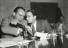 Roy Cohn whispers to Senator Joseph McCarthy at the Army-McCarthy hearings