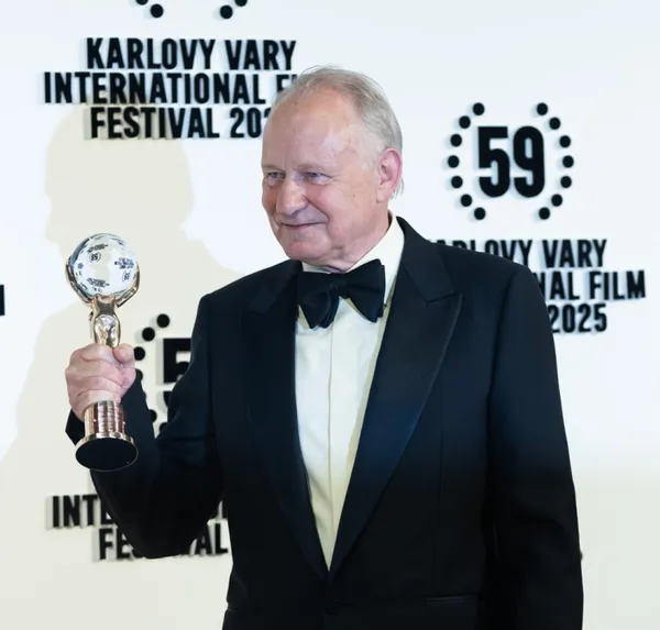 Stellan Skarsgard in Karlovy Vary holding his Crystal Globe