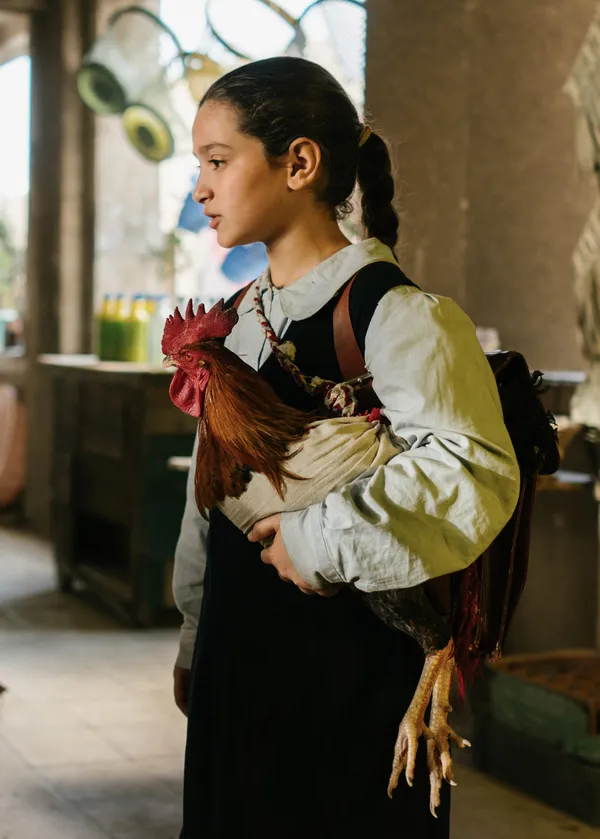A girl with a rooster