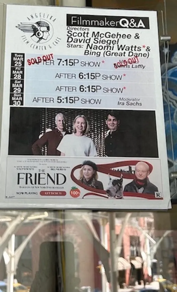 A poster, in a window, bearing the words "Filmmaker Q&A: directors David Siegel and Scott McGehee, stars: Naomi Watts and Bing (great Dane); after 7.15p show sold out; after 6.15p show; after 5.15p show; moderator Ira Sachs."