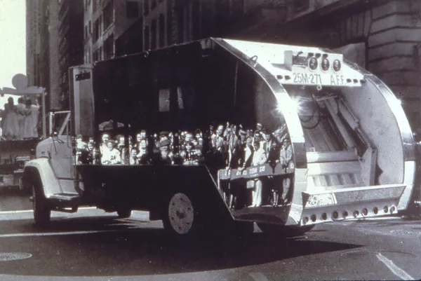 A black and white photograph of a mirrored van