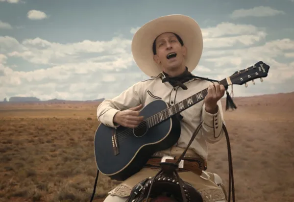 Tim Blake Nelson as Buster Scruggs
