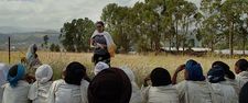 Welela Assaye speaking to the women of Megendi about childbirth health concerns