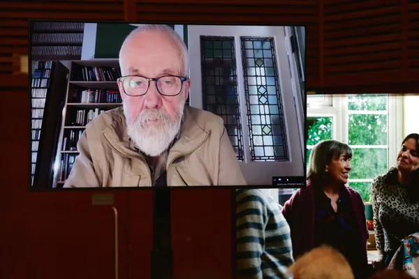 Mike Leigh dialling in to the press conference in San Sebastian