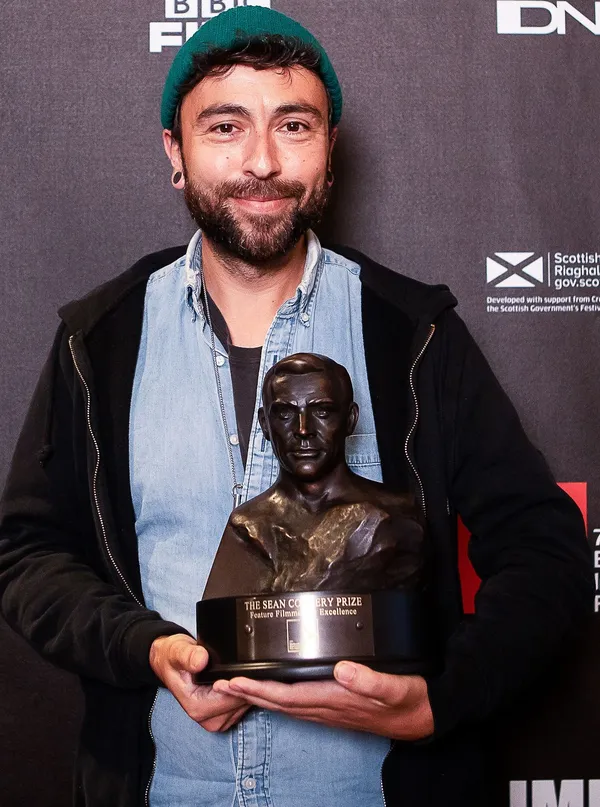 Last year's winner of the Sean Connery Prize Jack King holding the bust