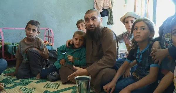 Abu Osama and his children in Of Fathers And Sons